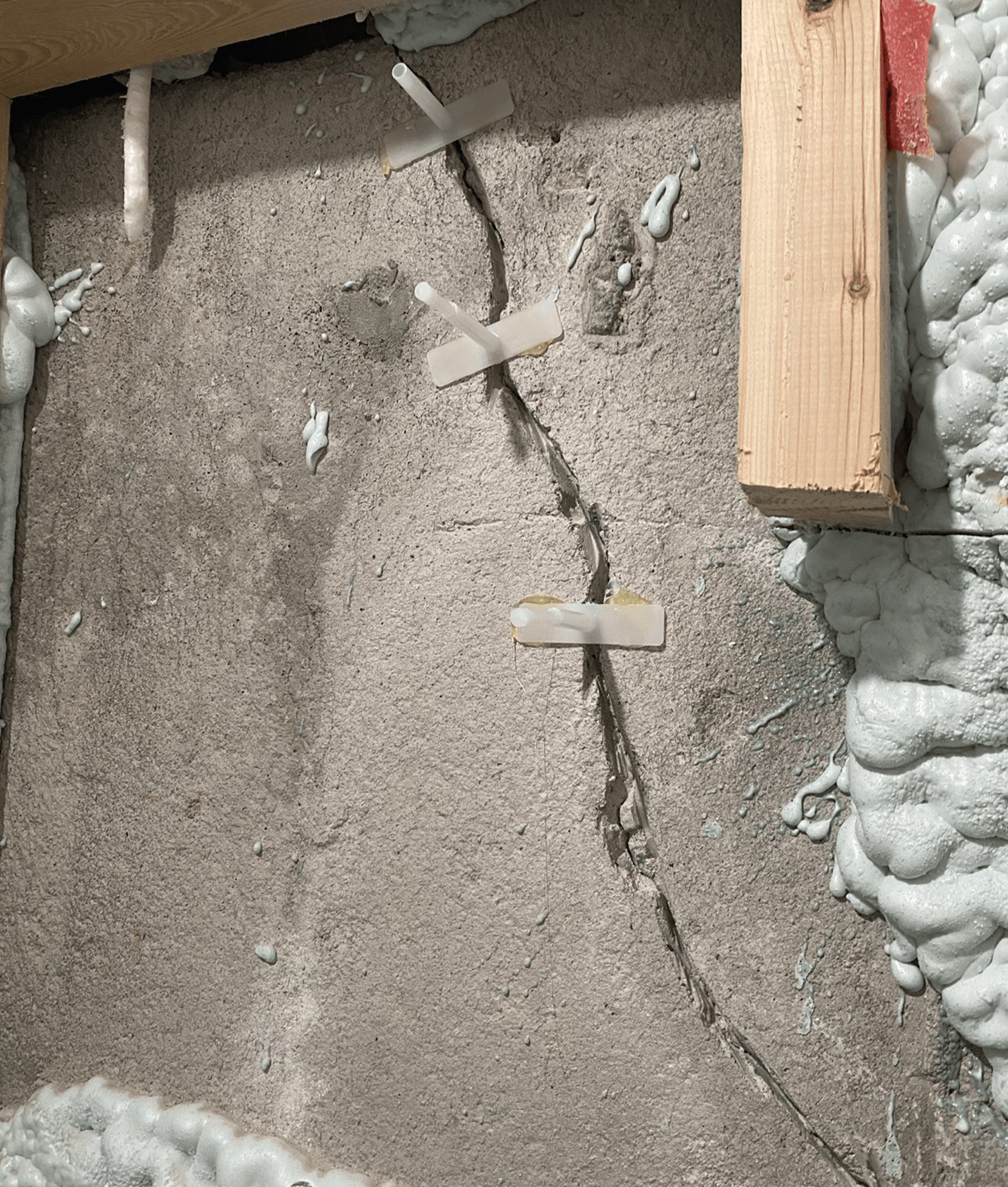 Foundation wall crack with injection ports installed for repair
